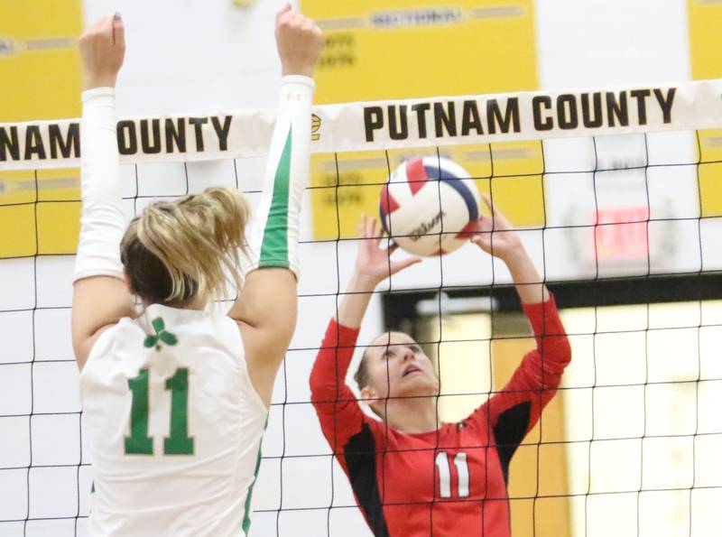 Henry-Senachwine's Alison Mitchell sets the ball in the air as Seneca's Franki Meyers watches the play during the Tri-County Conference championship game on Thursday, Oct. 16, 2025 at Putnam County High School.