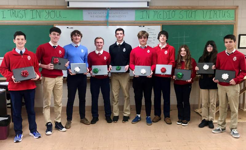 Marian Central Catholic High School Business Club member coordinated the donation of 10 gently used Chromebooks from the school to McHenry County PADS.