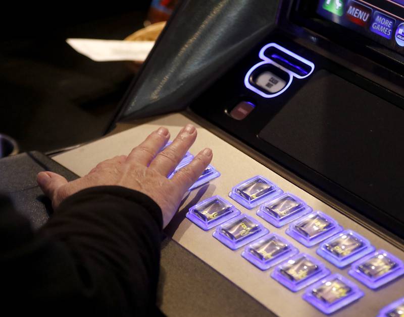 A customer plays a game on Tuesday, Nov. 28, 2023, at International House of Wine and Cheese in Richmond. Tom Jiaras, the owner of Hot Shots and the International House of Wine and Cheese, both which have electronic gaming, received a license for gaming in McHenry in October.