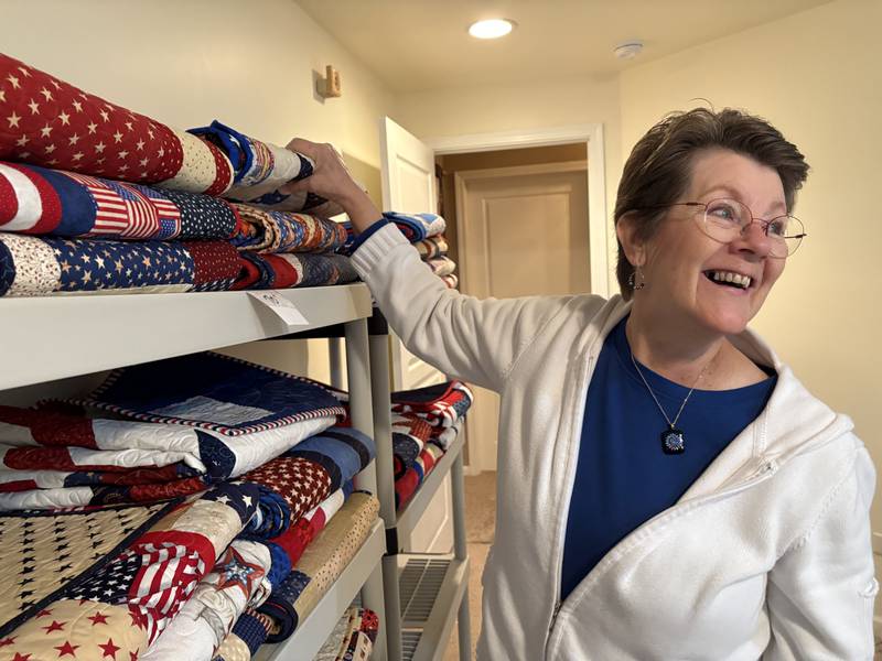 Bev Kenny picks out a quilt for a veteran Oct. 31, 2024 in Huntley.