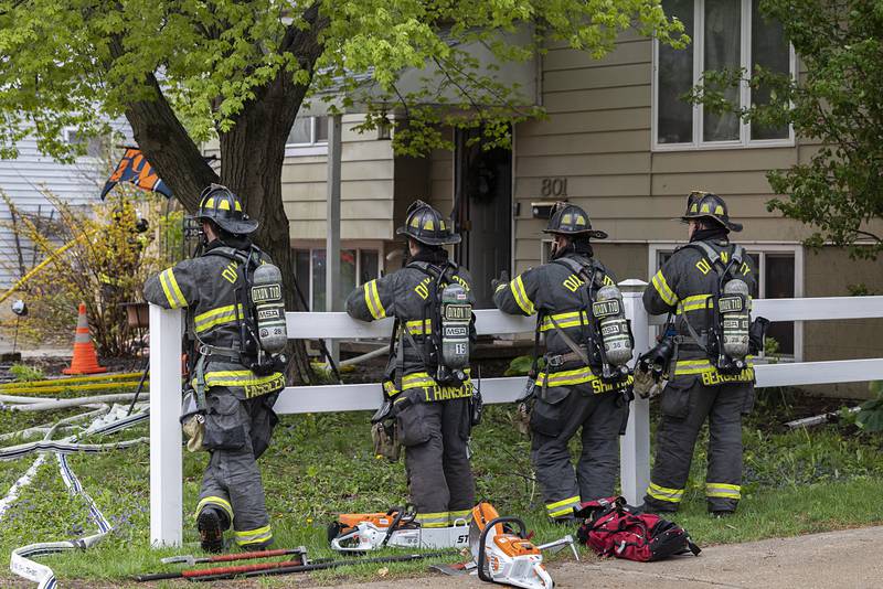 Dixon firefighters wait in the 800 block of Avenue I Monday, April 27, 2026, in Sterling after responding to a house fire.