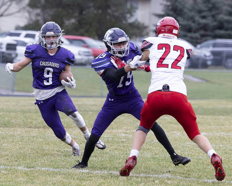 Rockford Lutheran’s John Behmer runs for yards Saturday, Nov. 5, 2022 during a round two football playoff game against Fulton.