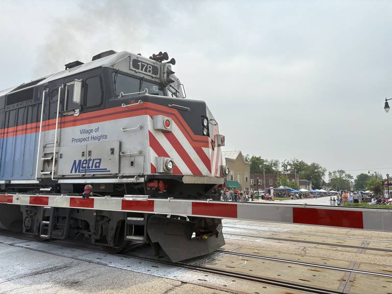 A train leaves Harvard station during the Harvard Milk Days parade June 7, 2025.