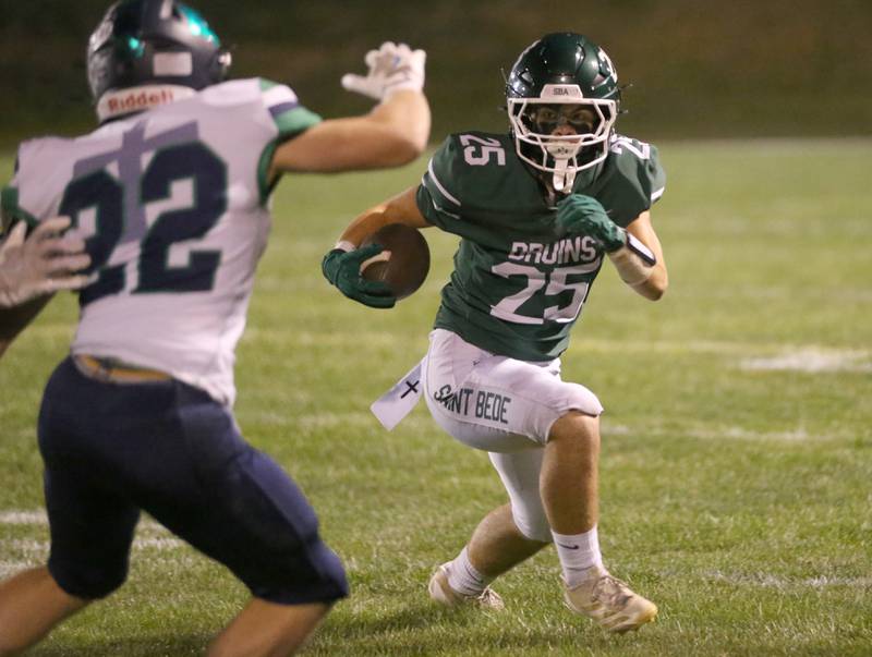 St. Bede's Brennen Hirst looks to get around Peoria Notre Dame's Blake Buckardt on Friday, Oct. 17, 2025 at St. Bede Academy.