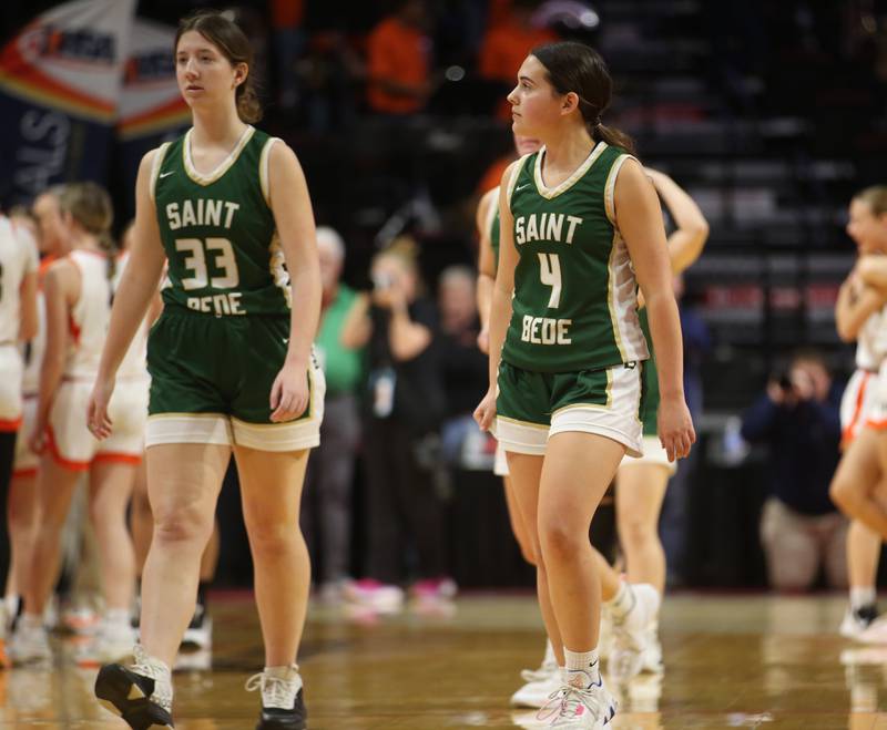 St. Bede's Ella Engelhaupt and Jenna Ladzinski walk off of the court after being defeated by Altamont during the Class 1A third-place game on Thursday, Feb. 29, 2024 at CEFCU Arena in Normal.
