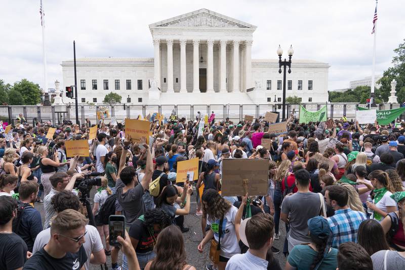 FILE - Protesters gather outside the Supreme Court in Washington, Friday, June 24, 2022, after the Supreme Court ended constitutional protections for abortion that had been in place nearly 50 years. More than a quarter of female Black voters describe abortion as their top issue in this year's presidential election, a new survey out Thursday from health policy research firm KFF finds. (AP Photo/Jacquelyn Martin, File)
