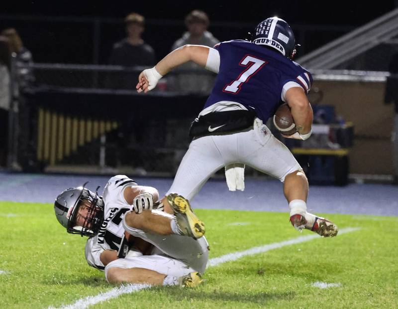 Kaneland's Brady Valentini sacks Belvidere North quarterback Andrew Bucci Friday, Nov. 7, 2025, during their Class 5A second round playoff game at Belvidere North High School.