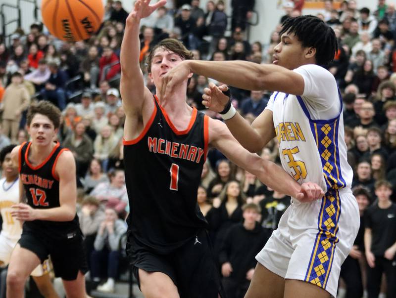Warren’s Avonn King, right, gets the ball past McHenry’ Dylan Hurckes in IHSA Class 4A Regional Title Game boys basketball action on Friday, Feb. 28, 2025 at McHenry High School in McHenry.