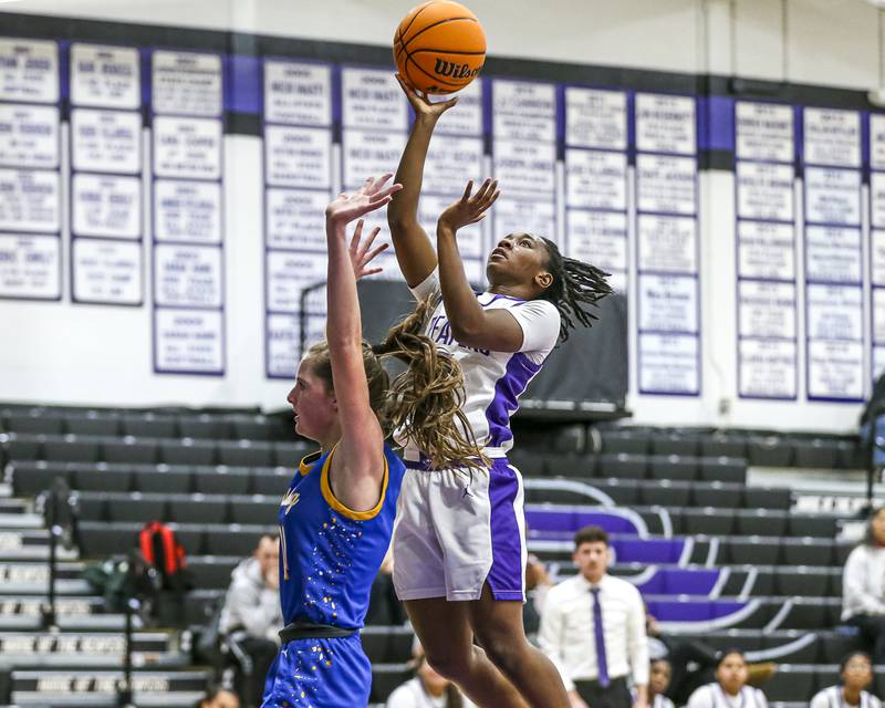 Plano's Sanai Young (2) puts in a lay up during their basketball game between Johnsburg at Plano, Monday Dec 16, 2024 in Plano.