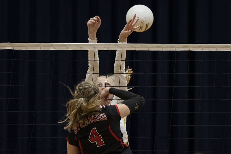 Polo’s Sydney Rahn works the net against Fulton’s Ava Bown in game one of their semifinal regional match Wednesday, Oct. 26, 2022.
