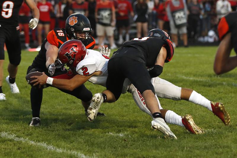 Huntley's Sam Deligio dives into the end zone to score a touchdown between Crystal Lake Central's Thomas Korn, left, and Crystal Lake Central's James Fier, right, during a Fox Valley Conference football game Friday, Aug. 26, 2022, between Crystal Lake Central and Huntley at Crystal Lake Central High School.