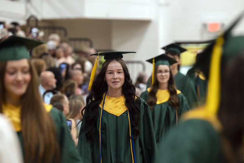 The Rock Falls High School Class of 2025 enter the gym Sunday, May 18, 2025, for the 146th commencement.