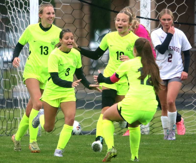 Richmond-Burton’s Rockets celebrate a goal by McKenzie Ragusca, center left, in IHSA Class 1A Regional Title Game action soccer at Marengo High School in Marengo on Wednesday, May 21, 2025.
