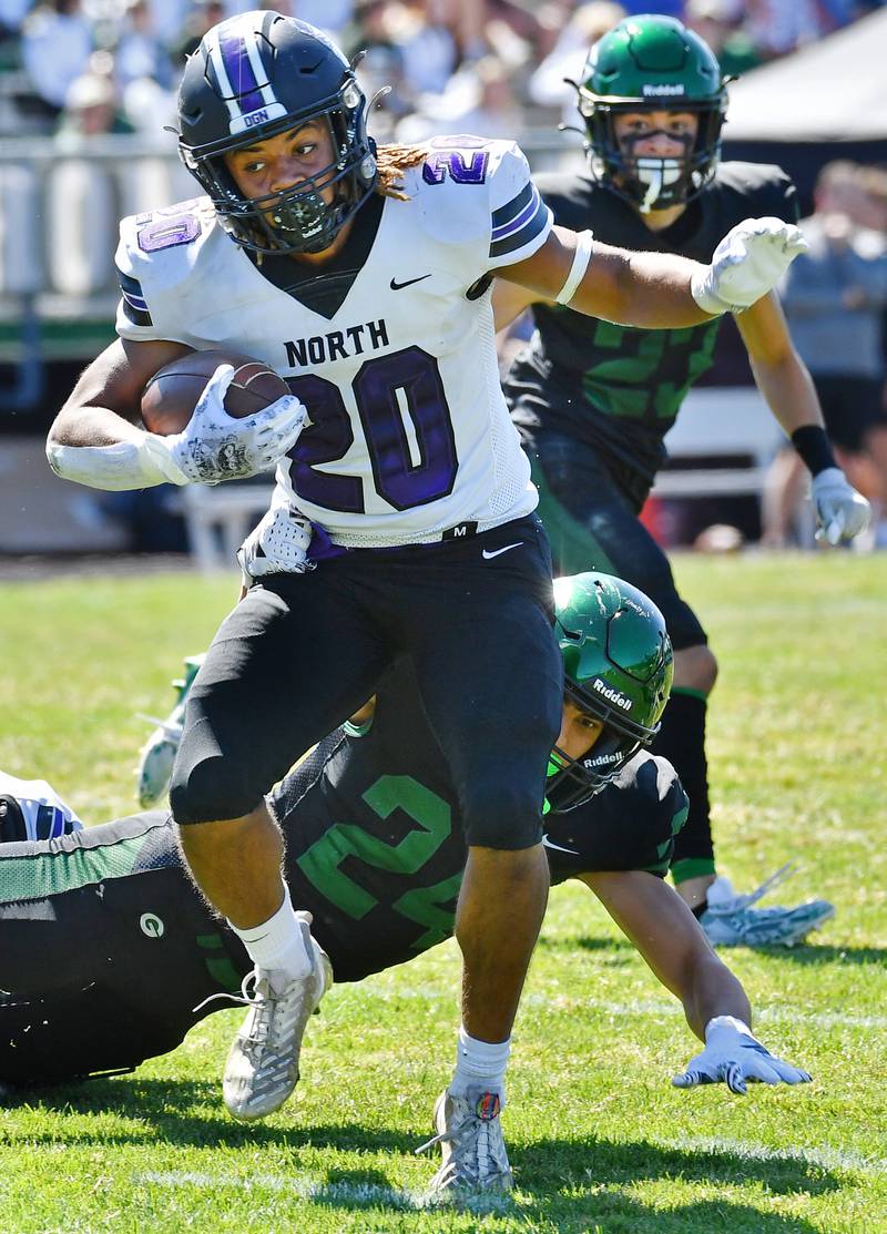 Downers Grove North's Noah Battle (20) leaves behind Glenbard West tackler Zach Altabarani during a game on Sep. 9, 2023 at Glenbard West High School in Glen Ellyn.
Jon Cunningham for Shaw Local News Network
