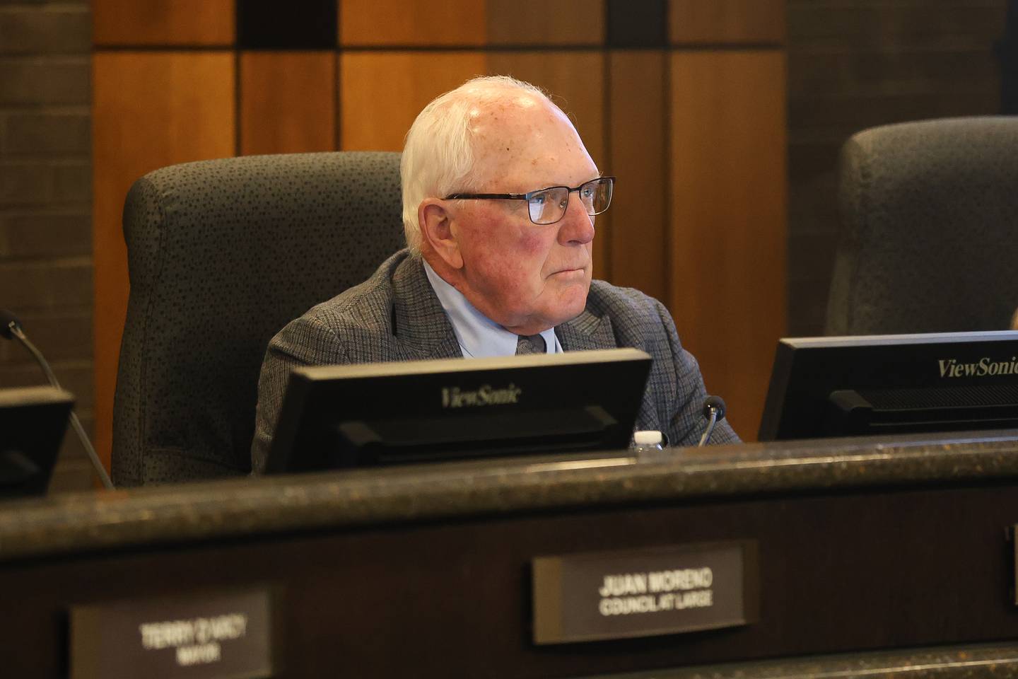 Councilman Pat Mudron, a former state wrestling champion for JCA, sits in on the Joliet city council meeting to vote on the Joliet Catholic Academy stadium plan on Tuesday, Jan 20, 2026 in Joliet.