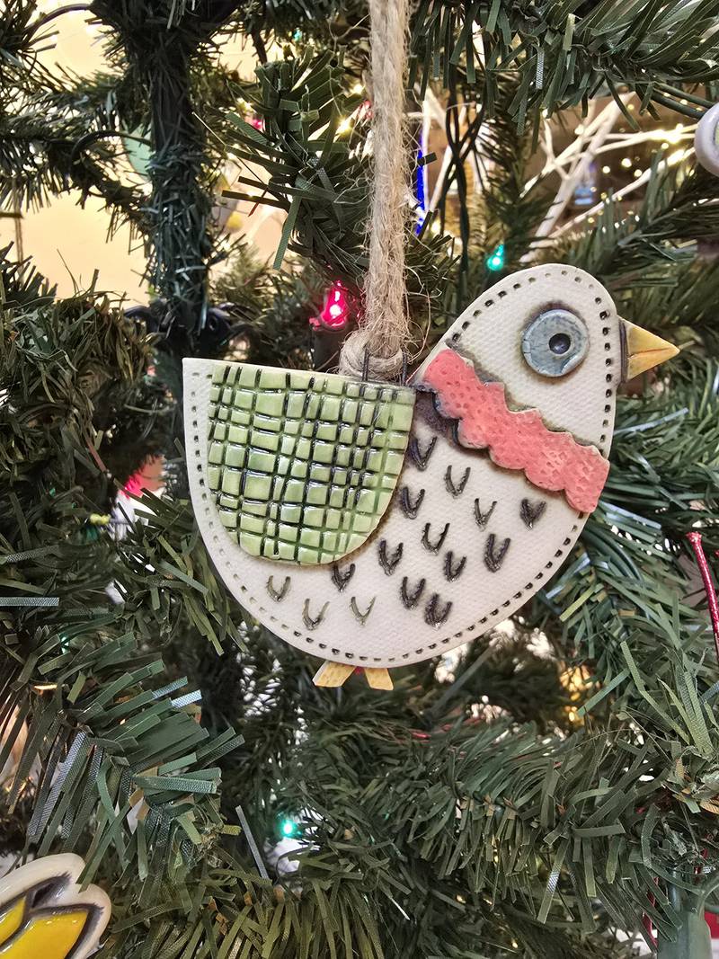 Janell Mayer has handcrafted ornaments and some holiday "uggles" for sale at the Artisans on Main in Woodstock.