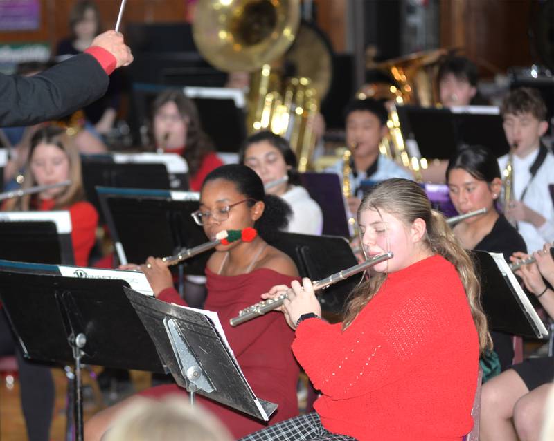 Nicole Girton and Aralin McLain play their flutes with the Oregon High School Concert Band during the Oregon Music Department's Christmas Concert on Sunday, Dec. 15, 2024 at Oregon High School.
