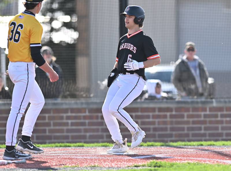 Lincoln-Way West's Ian Hazelip crosses home plate for a score during the non-conference game against Joliet West on Friday, April. 19, 2024, at Joliet.