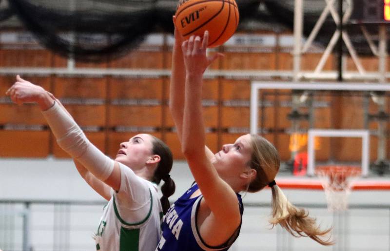Crystal Lake South’s Tessa Melhuish, left, battles Geneva’s Emma Peterson, right, for the ball in girls IHSA Class 3A Sectional Championship basketball on Thursday, Feb. 26, 2026, at Crystal Lake Central High School in Crystal Lake.