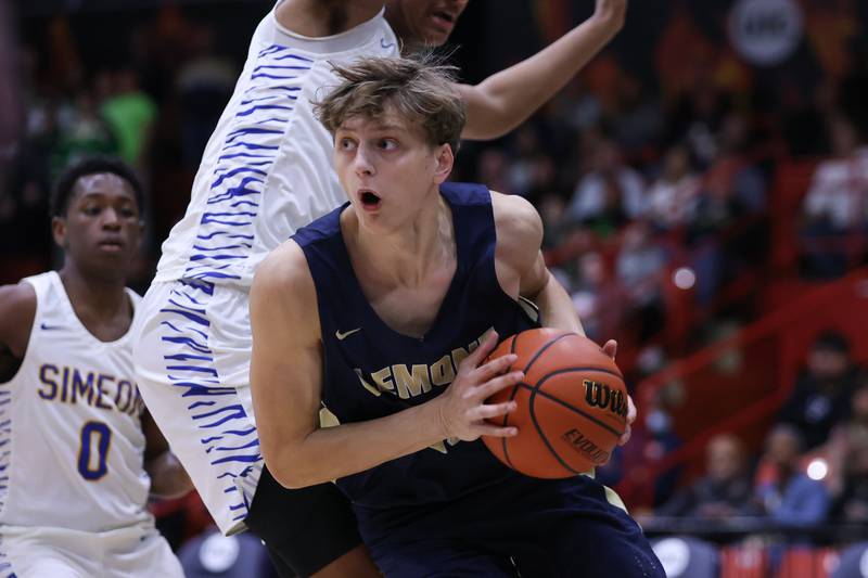 Lemont’s Nojus Indrusaitis battles his way to the basket against Simeon in the Class 3A super-sectional at UIC. Monday, Mar. 7, 2022, in Chicago.