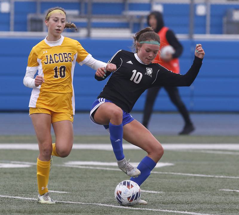 Lake Zurich’s Delilah Swartwood controls the ball in front of Jacobs' Gabby Wojtarowicz during a nonconference girls soccer match Tuesday, April 4, 2023, at Lake Zurich High School.