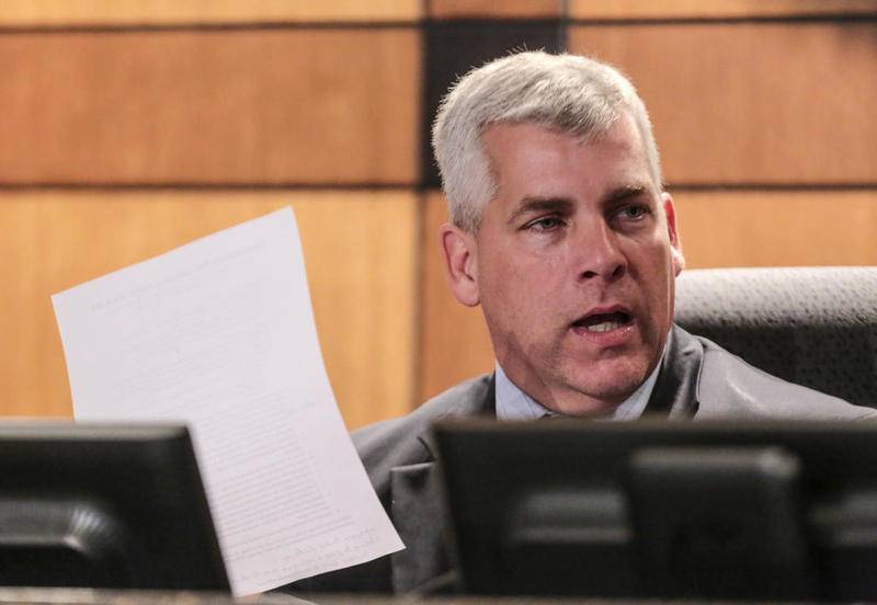 Mayor Bob O'Dekirk reads from a list of accomplishments former interim city manager Marty Shanahan completed during his time as the city manager Tuesday, June 18, 2019. Shanahan was removed after a 5-3 vote.