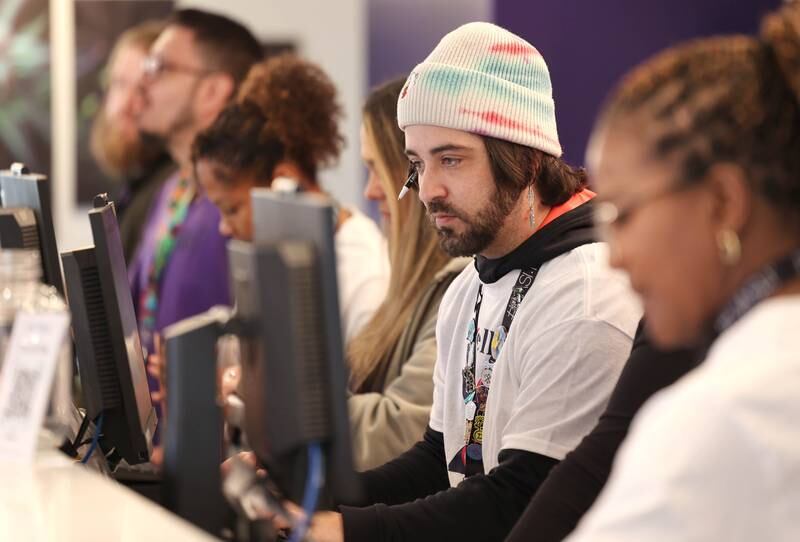 Excelleaf employees are busy helping customers Friday, Nov. 24, 2023, during the soft opening of the dispensary in DeKalb. The business is DeKalb County’s first recreational marijuana dispensary.