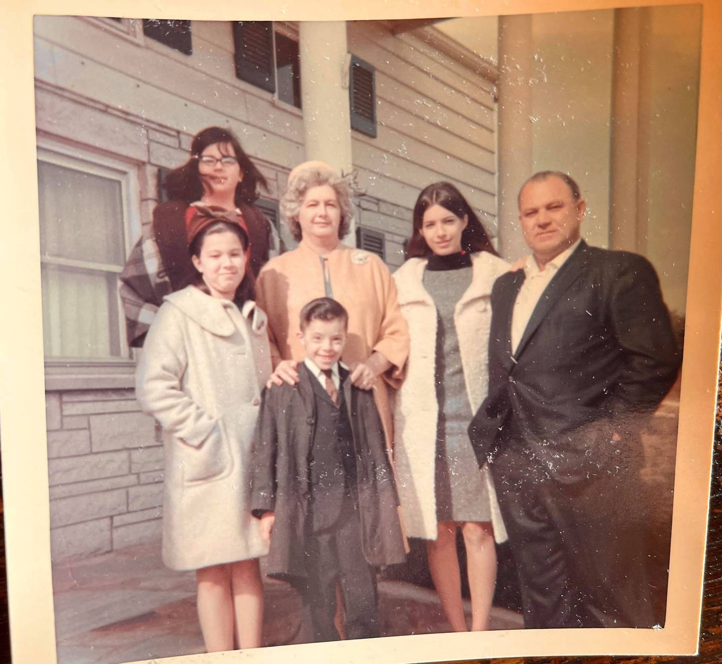 Carmel Perino is pictured next to her childhood home on Will Cook Road in Homer Glen, where Annunciation Byzantine Catholic Church now stands. She is seen with her parents Antonio and Angela Perino and her brother Bruno (front, deceased) and sisters Phyllis (front left) and Elizabeth (back left).