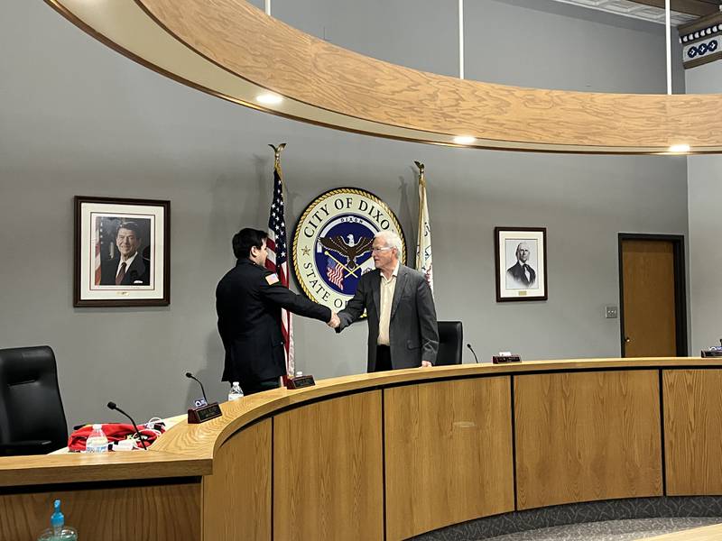 Dixon Mayor Glen Hughes (right) administered the oath of office for firefighter/EMT Tristan Ramirez at the Dixon City Council meeting, Monday, May 19, 2025.