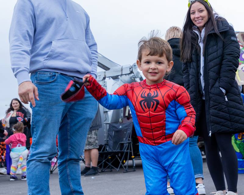 Jared Cinotto swings Spider-Man mask around at the trunk or treat event on Saturday, October 25, 2025 at Illinois Valley Auto Group in Peru.