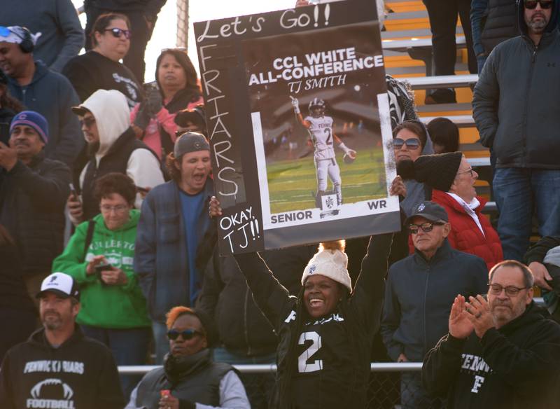 Fenwick fan Freya Hatchett cheers on the team during their playoff game against Brother Rice Saturday, Nov. 2, 2024.