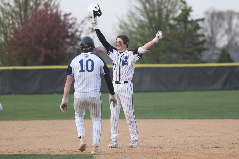 Lincoln-Way East’s starting pitcher Zach Kwasny (10) is the first to greet Aiden Knipper after his walk-off single against Lincoln-Way West in the Griffins 3-2 on Monday, April 24, 2023 in Frankfort.