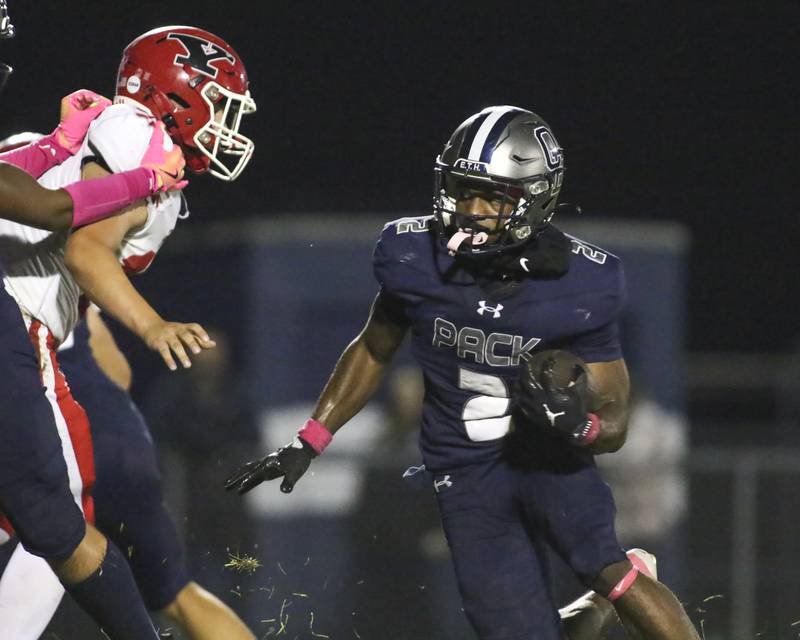 Oswego East's Jasiah Watson (2) runs in a late touchdown during football game between Yorkville at Oswego East Friday, Oct 10, 2025 in Oswego.