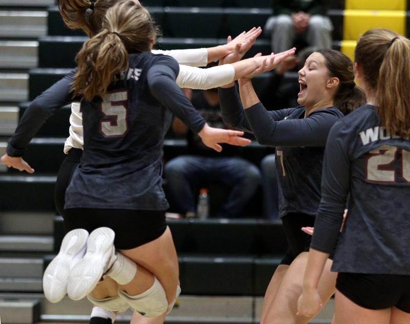 Prairie Ridge’s Wolves get revved up in their three-set loss  in varsity volleyball at Crystal Lake South Tuesday night.
