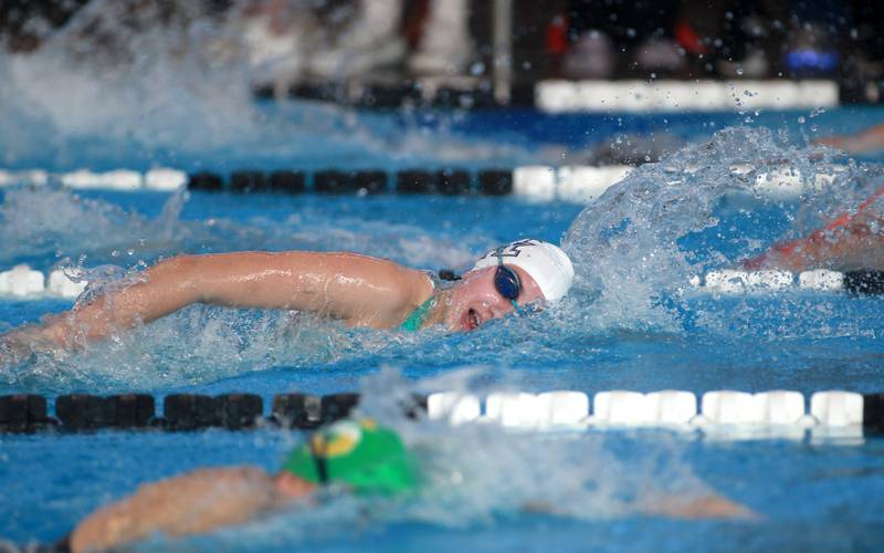 West Chicago co-op’s Audrey Lindstrom swims the 200-yard freestyle consolation heat during the IHSA Girls State Swimming and Diving Championships at the FMC Natatorium in Westmont on Saturday, Nov. 11, 2023.