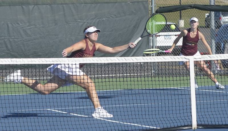 The Morris doubles team of senior Julia Borgstrom and junior Skyler Saelens work for a point during their doubles finals match against Pontiac of Saturday's Class 1A Ottawa Sectional at the Henderson-Guenther Tennis Facility.