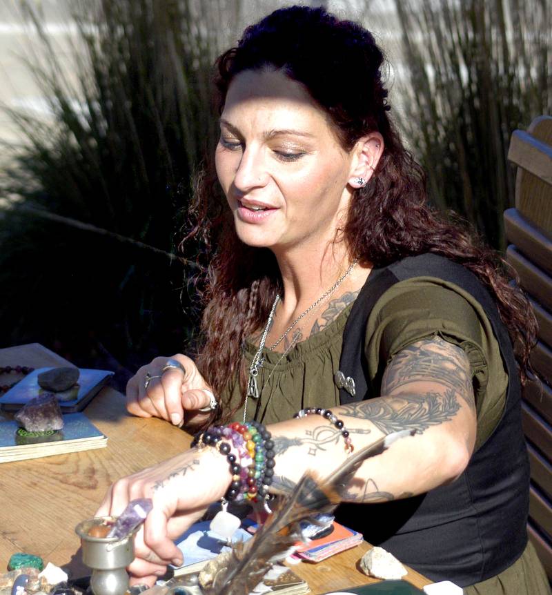 Tarot reader "Silence" reads cards at the Sterling Halloween town. The Craft Beer Festival and Halloween Town offered fun for all in downtown Sterling on Saturday, Oct. 11.