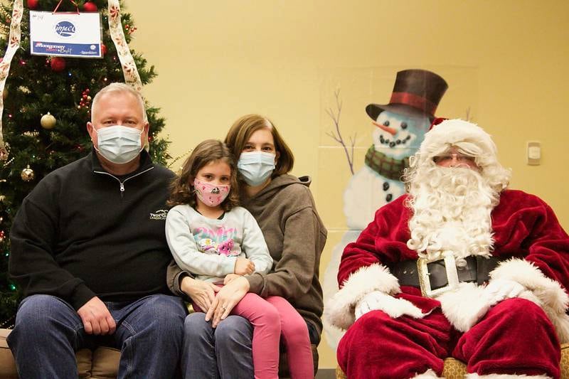 Montgomery Village Trustee Steve Jungermann, his wife Donna and their daughter Morgan were just one of many families that met Santa and Mrs. Claus inside of Montgomery's Village Hall Dec. 5, as they visited with families during the annual tree lighting ceremony.