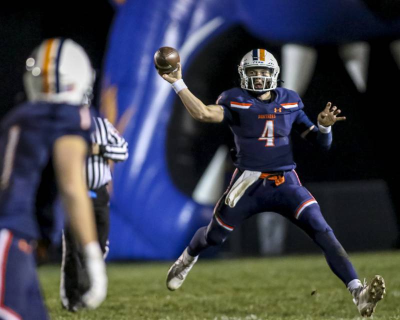 Oswego's Drew Kleinhans (4) throws a pass during Class 8A semifinal football game between Lockport at Oswego. Saturday, Nov 22, 2025 in Oswego.