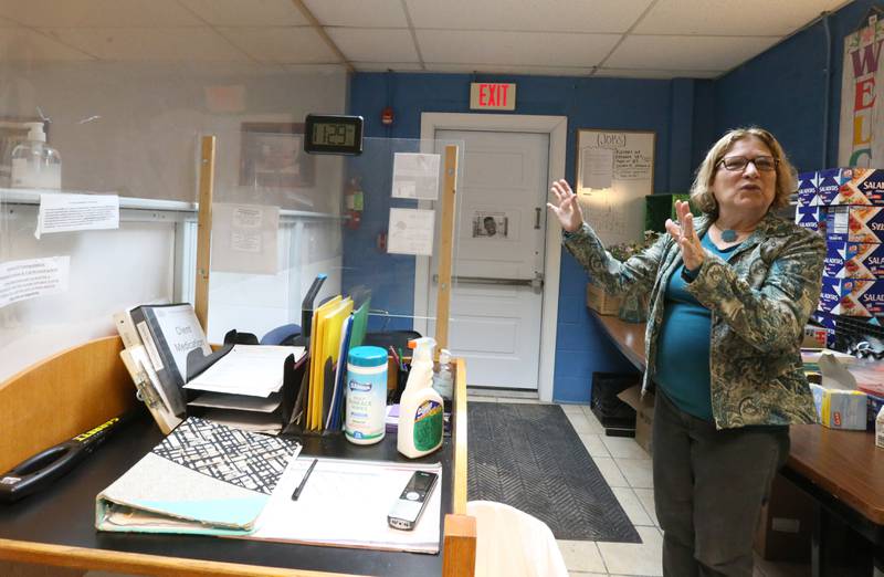 Carol Alcorn executive director of the Illinois Valley Public Action To Deliver Shelter (PADS) shows the small space where clients check in on Wednesday, Feb. 1, 2023 in Ottawa.