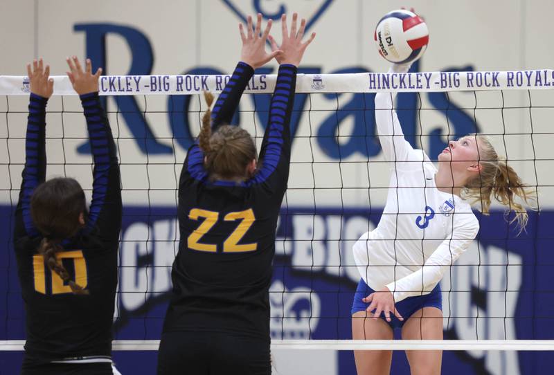 Hinckley-Big Rock's Brynn Gawel tries to spike the ball by Somonauk's Morgan Potter and Alexis Matejovsky during their match Thursday, Sept. 15, 2022, at Hinckley-Big Rock High School.
