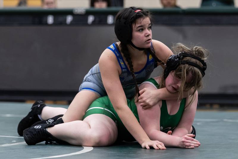 Joliet Central's Jaylin Ingram takes on Niamh Patterson of Plainfield Central in the 145-pound match at Plainfield Central on January 13, 2025.