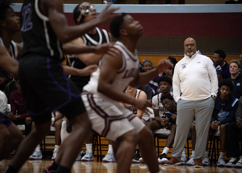 Kankakee's head coach Chris Pickett, right, watches the action on the floor in a game against Thornton on Friday, December 12, 2025.