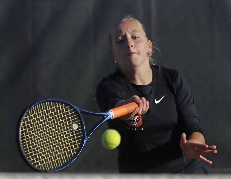 Crystal Lake Central’s Evie Johnson returns the ball Thursday, Oct. 23, 2025, during the first day of the IHSA State Girls Tennis Tournament at Schaumburg High School.