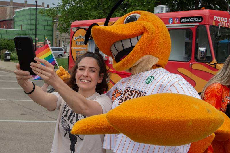 Fan takes selfie with “South Claw Sam” Mascot of Pistol Shrimp on Saturday, June 8, 2024 at Jordan Block Park in Ottawa.