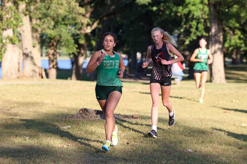 Bishop McNamara's Ana Franceschini maintains her lead ahead of Bradley-Bourbonnais' Makenzie Goodman in the girls 3-mile race during All-Area Cross Country meet on Wednesday, Oct. 8, 2025, at Kankakee Community College.