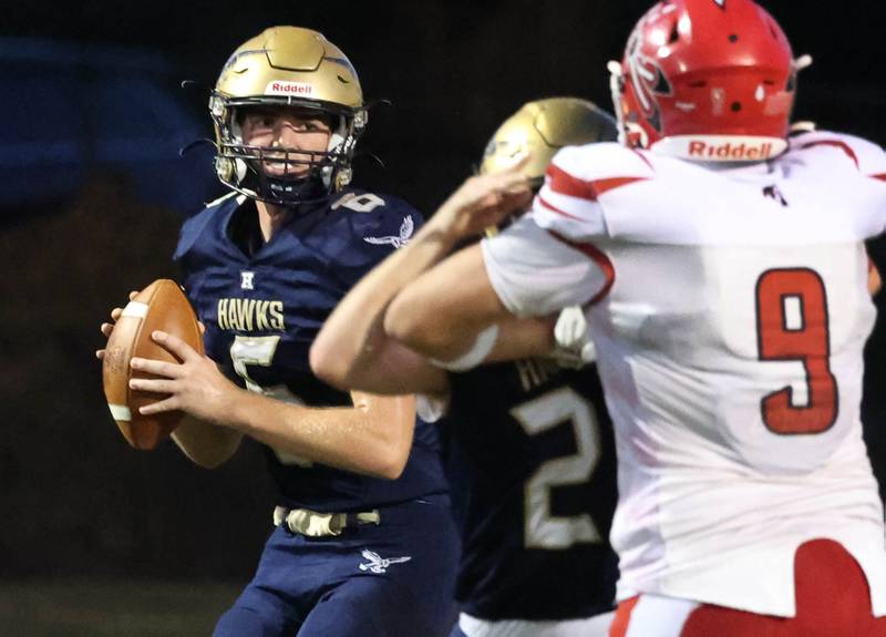 Hiawatha's Aiden Cooper has time to look for a receiver as he gets good blocking from teammate Michael Hobson during their game against South Beloit Friday, Sept. 20, 2024, at Hiawatha High School in Kirkland.