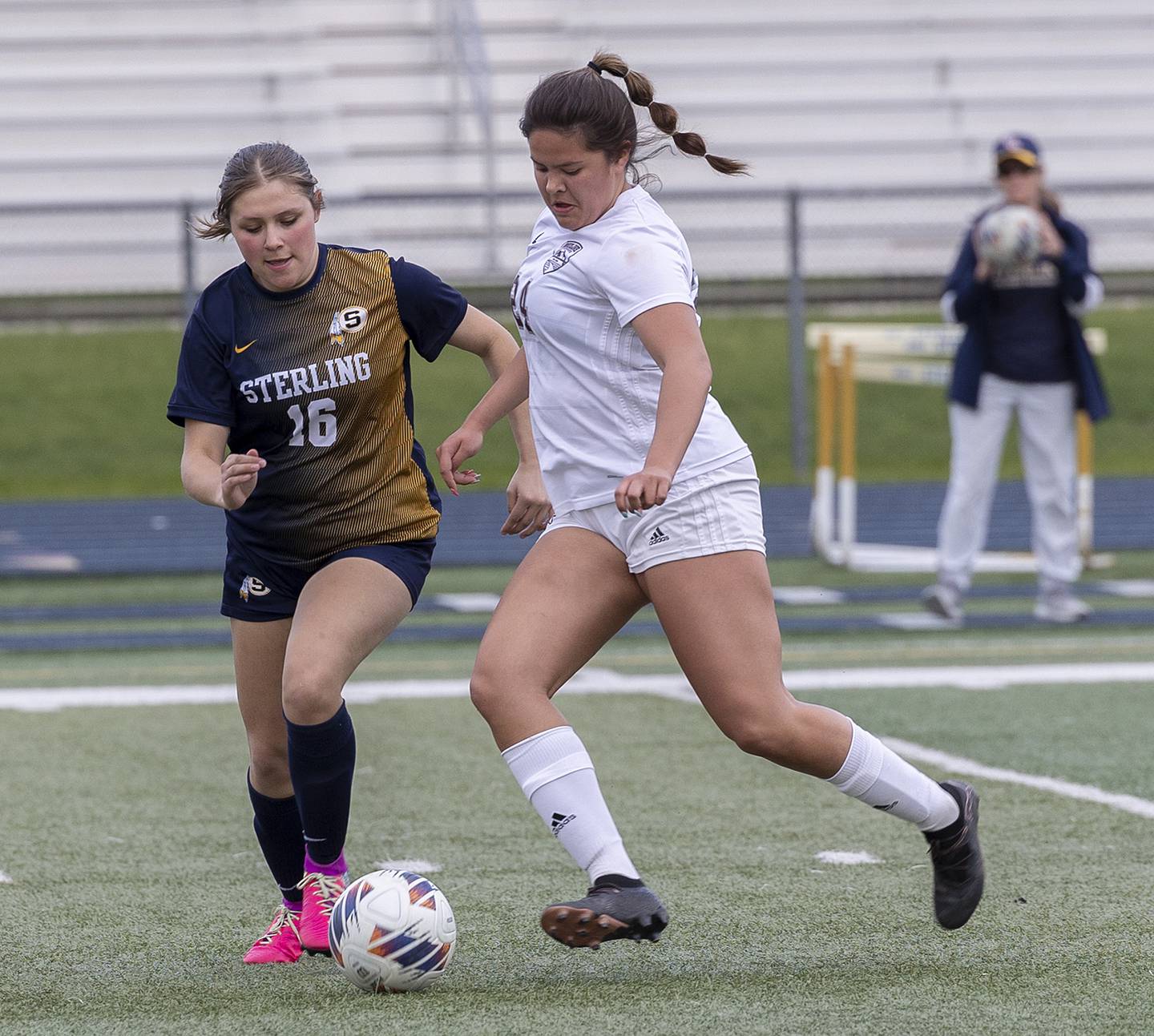 Sterling’s Illyana Moreno and Moline’s Charlise Martel battle for the ball Tuesday, April 30, 2024 at Sterling High School.