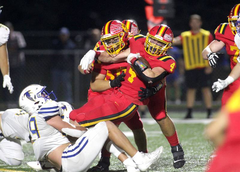 Batavia’s Charlie Whelpley is taken down by Wheaton North’s Walker Owens during a game at Batavia on Friday, Sept. 22, 2023.