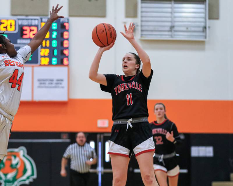 Yorkville's Brooke Spychalski (11) shoots a jump shot during varsity basketball game between Yorkville at Plainfield East.  Jan 3, 2023.